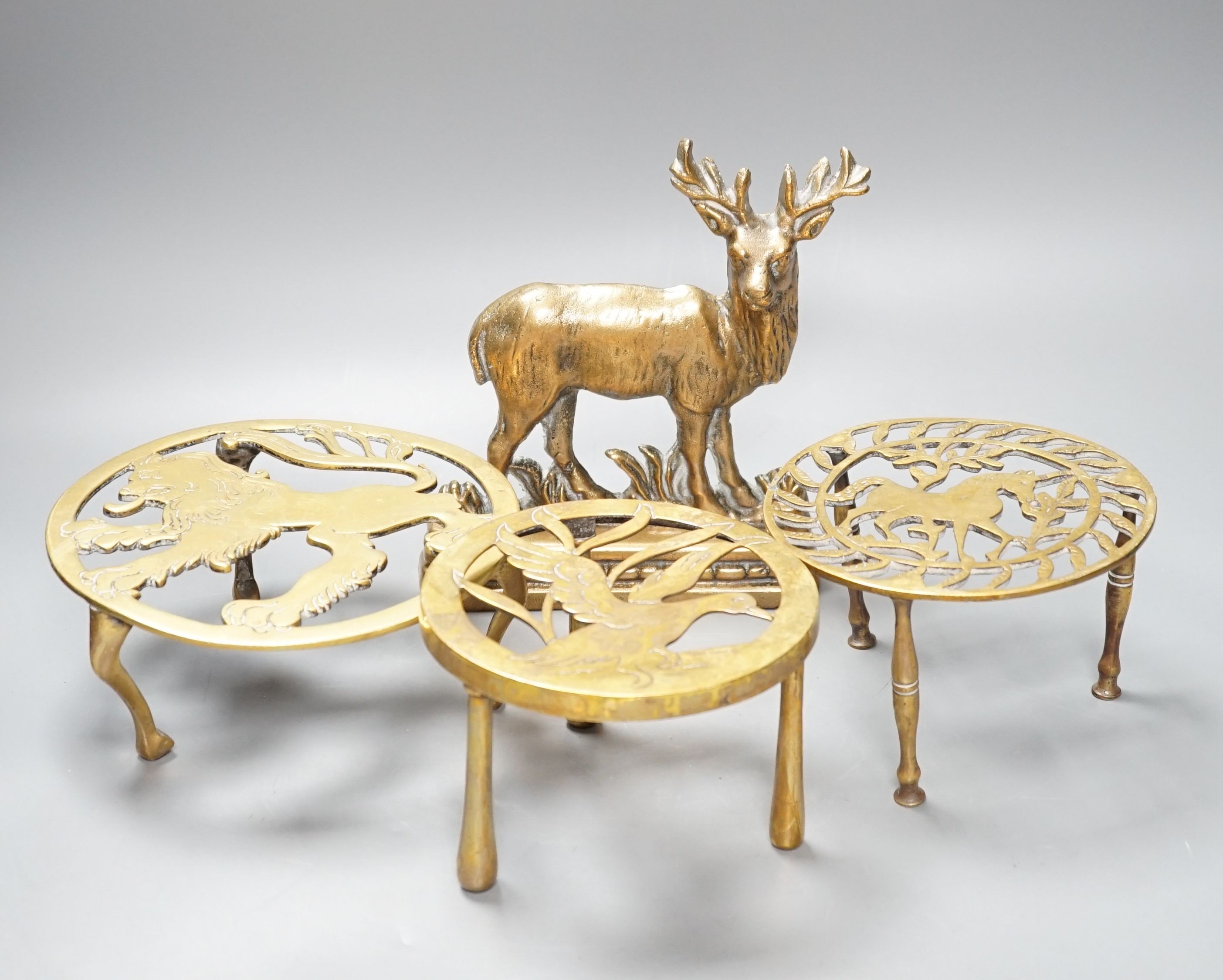 Assorted brass trivets and other brassware